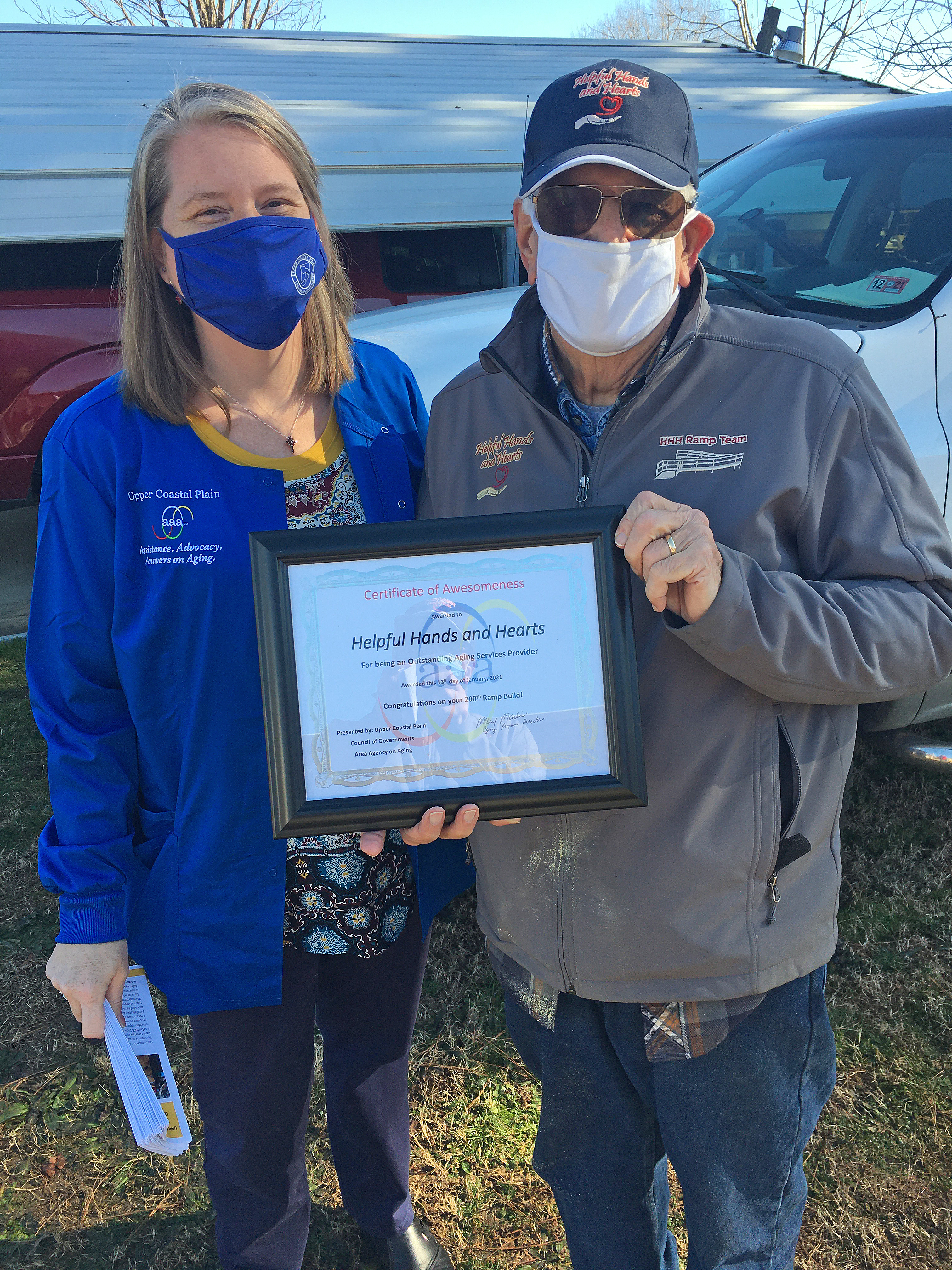 Mary Marlin of the Upper Coastal Plain Area Agency presents HHH with a certificate of awesomeness
